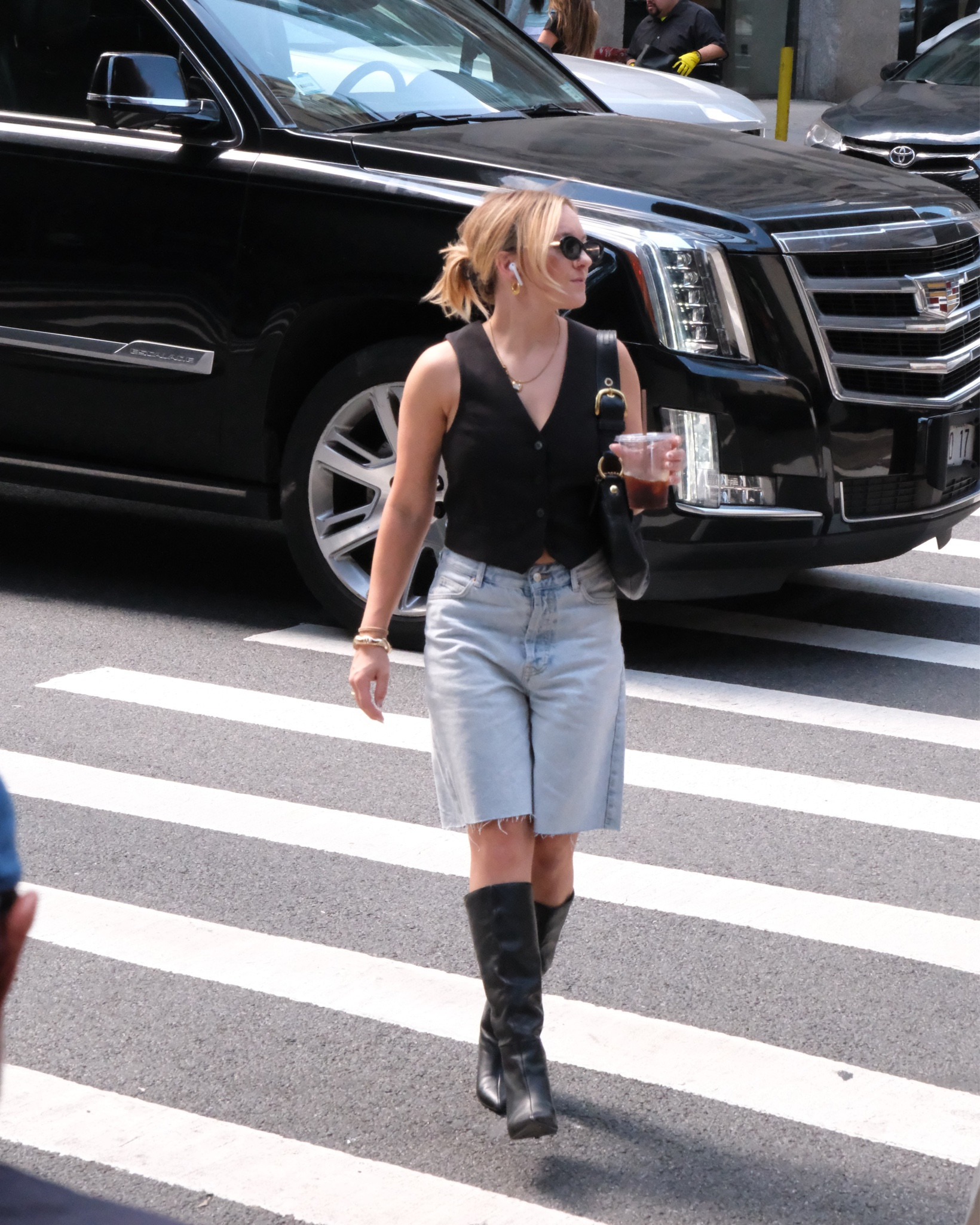 Black vest top with longline shorts and tall slouchy boots 🤌🏻 #vest #vesttop #ltkfall 

#LTKStyleTip #LTKTravel 