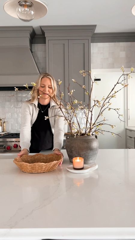 Kitchen Counter Spring Style. I have the white color of the stems. There are 3 stems in my vase. Each branch is 59” tall. This is the cutest basket tray and only $10! I can never pass up a vintage pot with small handles! 

#LTKhome #LTKSeasonal #LTKstyletip