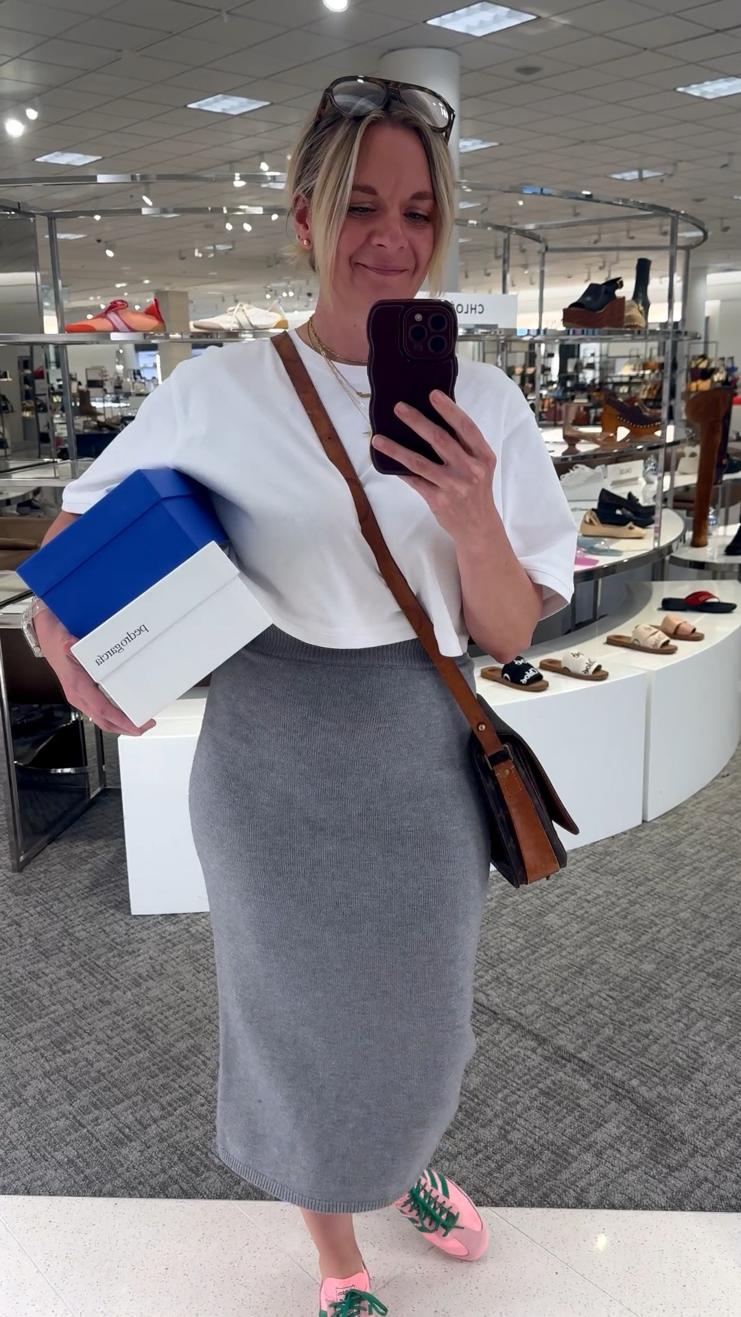 Unpopular opinion: sneakers look better with a midi skirt than heels do 👇

Here's why:

👟 It's unexpected — and unexpected is always more interesting. Everyone pairs a midi skirt with heels or sandals. A great sneaker does something a heel can't — it creates contrast and makes the outfit feel current instead of predictable.

👟 It balances the femininity of the skirt perfectly. A knit midi skirt is soft, fitted, and inherently feminine. A sneaker brings just enough edge and casualness to keep the whole look from feeling too precious or overdressed.

👟 It makes the outfit actually wearable all day. You can style a midi skirt and look completely put together without sacrificing comfort. A cropped tee, a knit midi, a great sneaker — that's a full outfit that works from morning through evening without a single second thought.

OOTD while setting up for a client personal shopping appointment ✨ White cropped tee + grey knit midi skirt + pink and green sneakers + layered necklaces. All from my own closet — linked the closest versions I could find so you can shop the look. Everything shoppable below! 👇

#LTKdayinmylife #LTKootd #LTKOver40