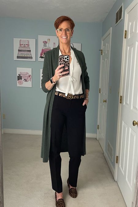 Black and white with a bit of color. Add a cardigan for perfect fall layers. 

Classic outfit, fall outfit, duster cardigan, olive cardigan, black pants, white shirt

#LTKstyletip