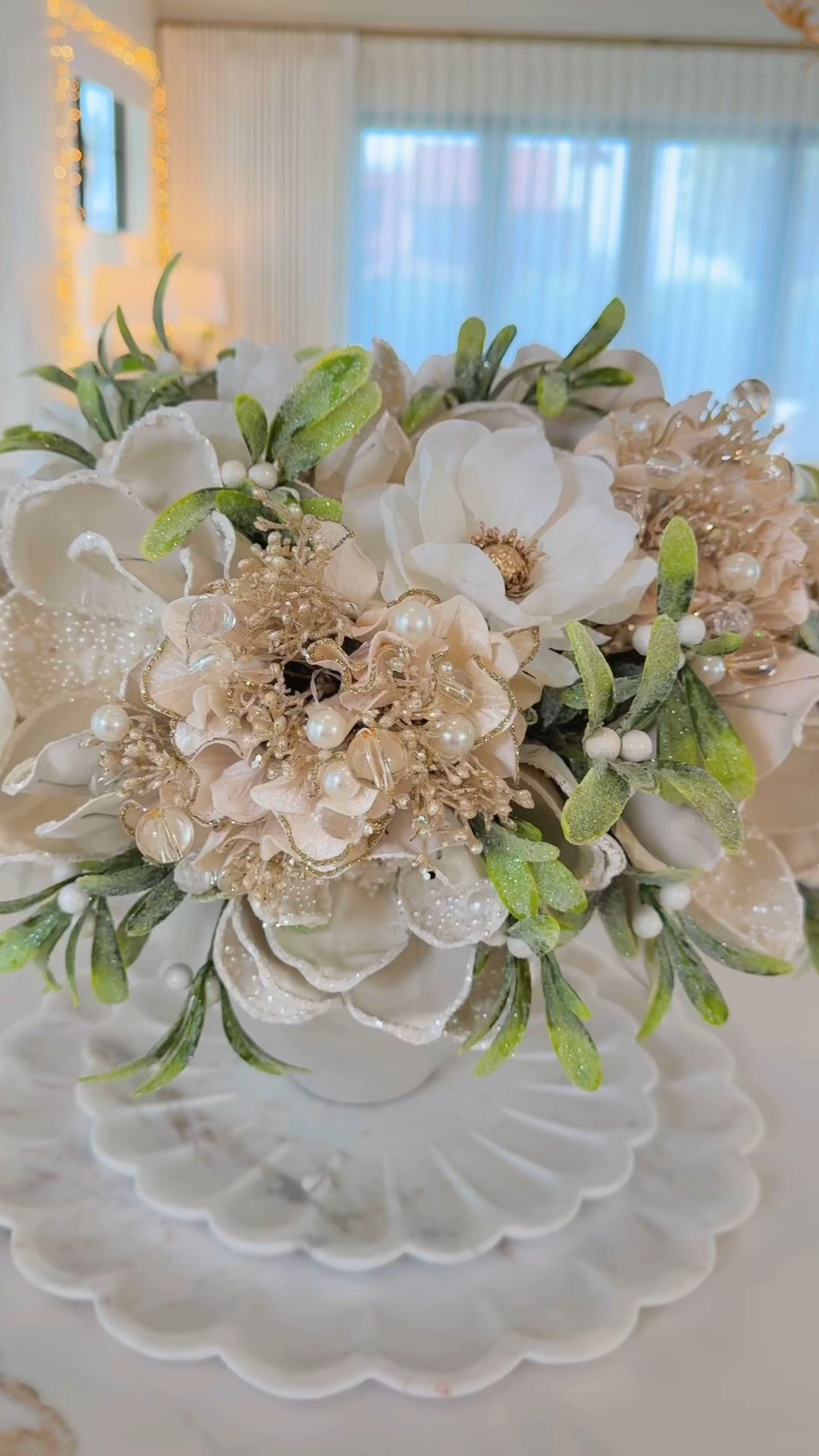 Christmas floral arrangement 🎄💫
I pulled together a flower arrangement for my kitchen using several shimmery, snowy stems. I love the way the jeweled hydrangea and pearl magnolia looks with the mistletoe. I simply added tape across the top of the vase then began placing stems until I achieved the look I wanted.

#LTKHoliday #LTKHome #LTKSeasonal