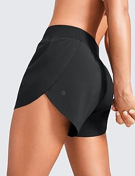 CRZ YOGA Mid Waisted Dolphin Athletic Shorts for Women 4" Lightweight High Split Gym Workout Shor... | Amazon (US)