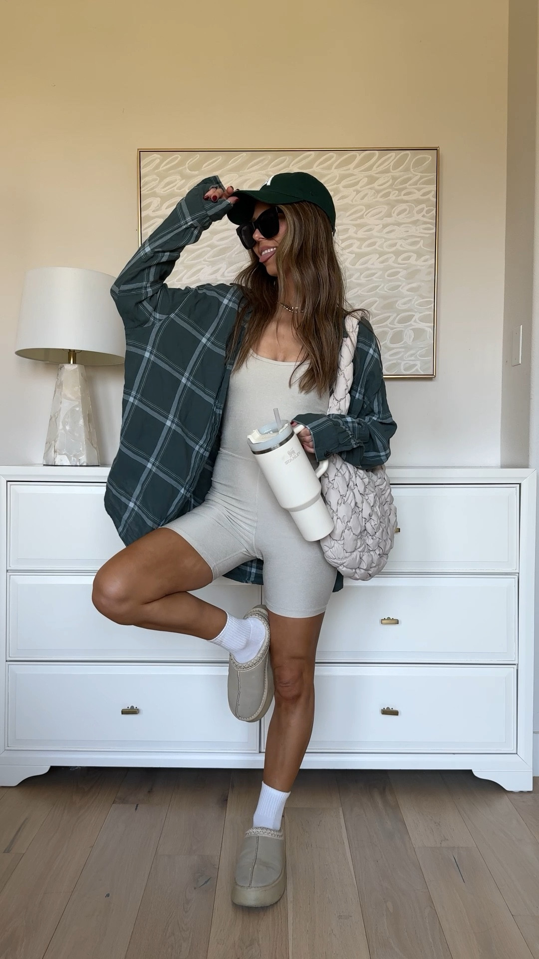 Shorts onesie and plaid shirt outfit! Wearing xs onesie and it’s on clearance for as low as $9!!!! Size large plaid button down I’m wearing on repeat. Amazon slippers  

#LTKFindsUnder50 #LTKSaleAlert #LTKVideo