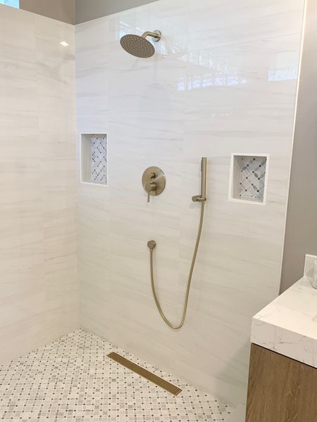 Brushed brass shower system and d
Shower drain.  Bathroom decor, bathroom remodel 

#LTKFind #LTKfamily #LTKhome
