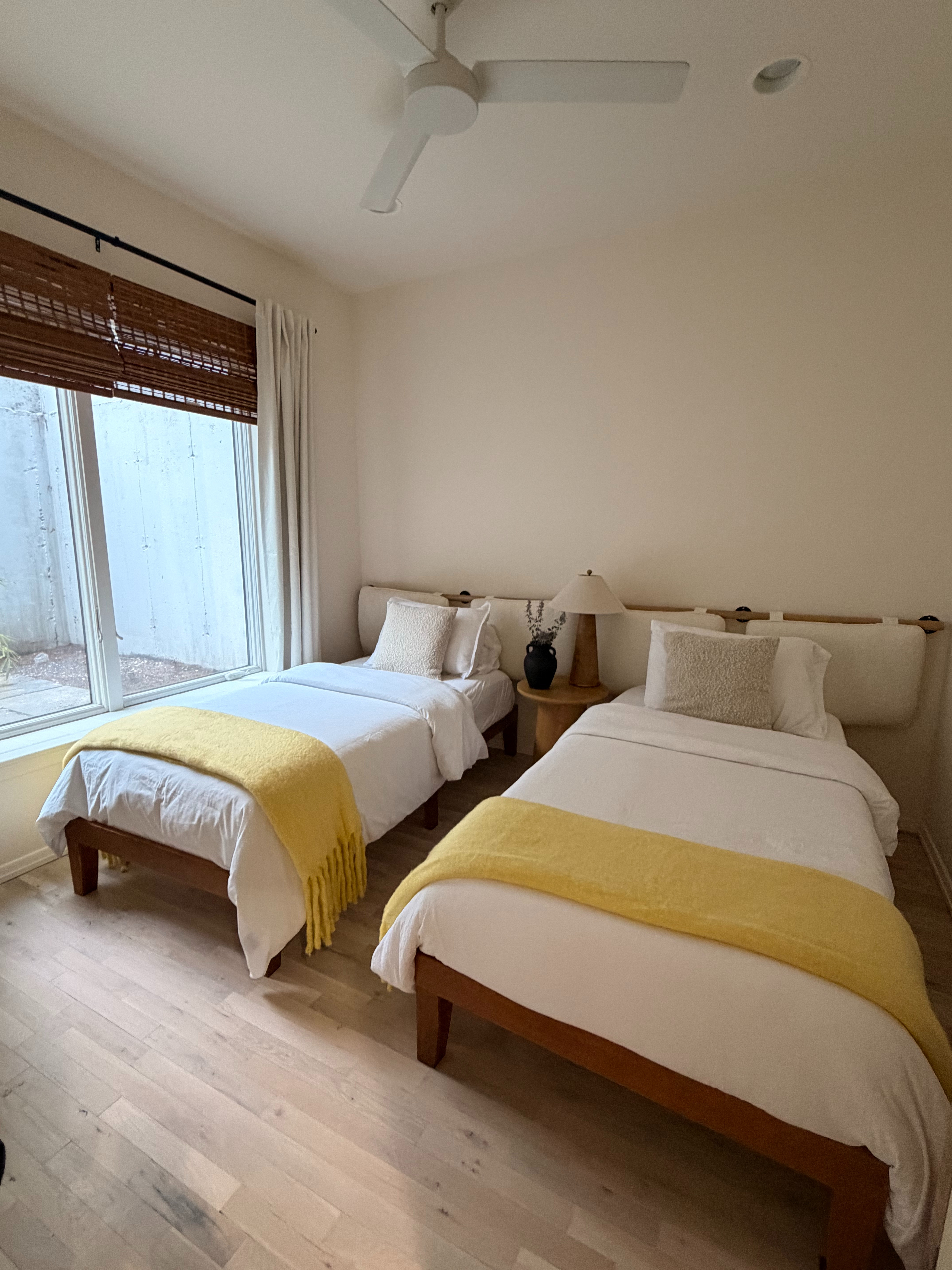 Even twin rooms deserve the same attention as the primary bedroom. Matching beds, layered bedding, warm wood furniture, and simple styling make the space feel cohesive and welcoming for every guest.

Linking the exact and similar pieces here.

#LTKHome #LTKSaleAlert