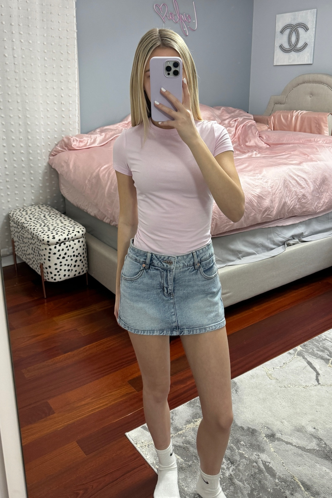 Super cute summer outfit. Light pink shirt and denim micro skirt