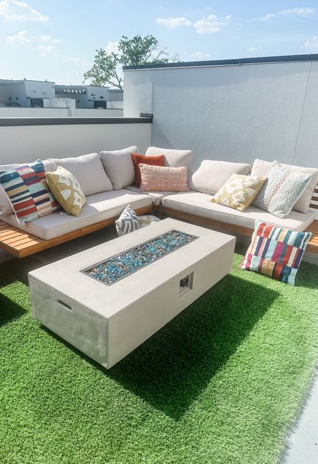 Rooftop outdoor patio 
Modern teak sectional 
Fire pit 


#LTKsalealert #LTKSeasonal #LTKhome