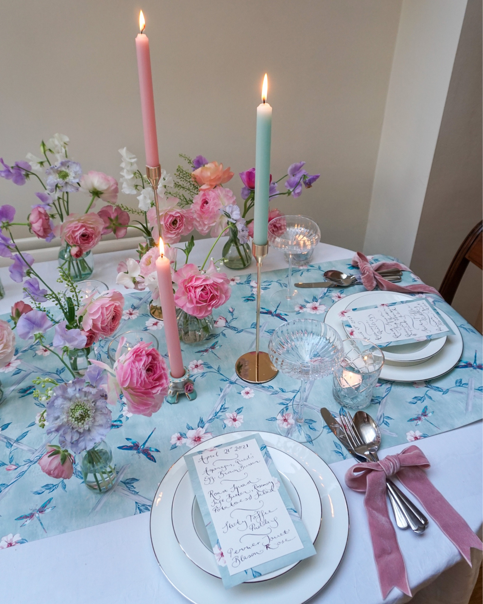 A floral date night tablescape for the weekend. The runner is made from a wallpaper sample (Rosanna Trellis). Cutlery tied with velvet ribbons and homemade menus. Flower arranged in bud vases. 

#LTKhome #LTKparties #LTKunder50