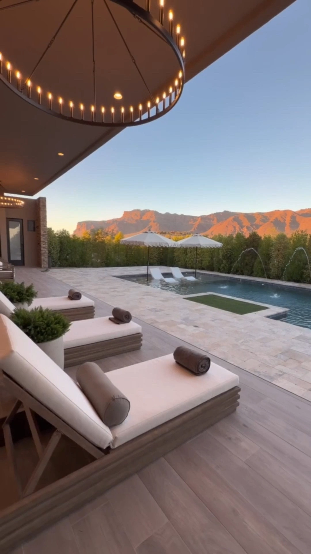 This has been my favorite spot lately 🤍

These designer inspired outdoor finds came together so beautifully. Chaise lounges, fluted chairs, sculptural umbrellas, and concrete side tables… it just feels calm and elevated.
Loving the UV faux bushes and florals in the oversized pots 🌿 the easiest maintenance ever and look real! 

outdoor patio furniture 
designer inspired outdoor
modern patio furniture
faux outdoor plants
resort style patio

#summerthompsonstyles


#LTKHome #LTKSwim #LTKmomlife