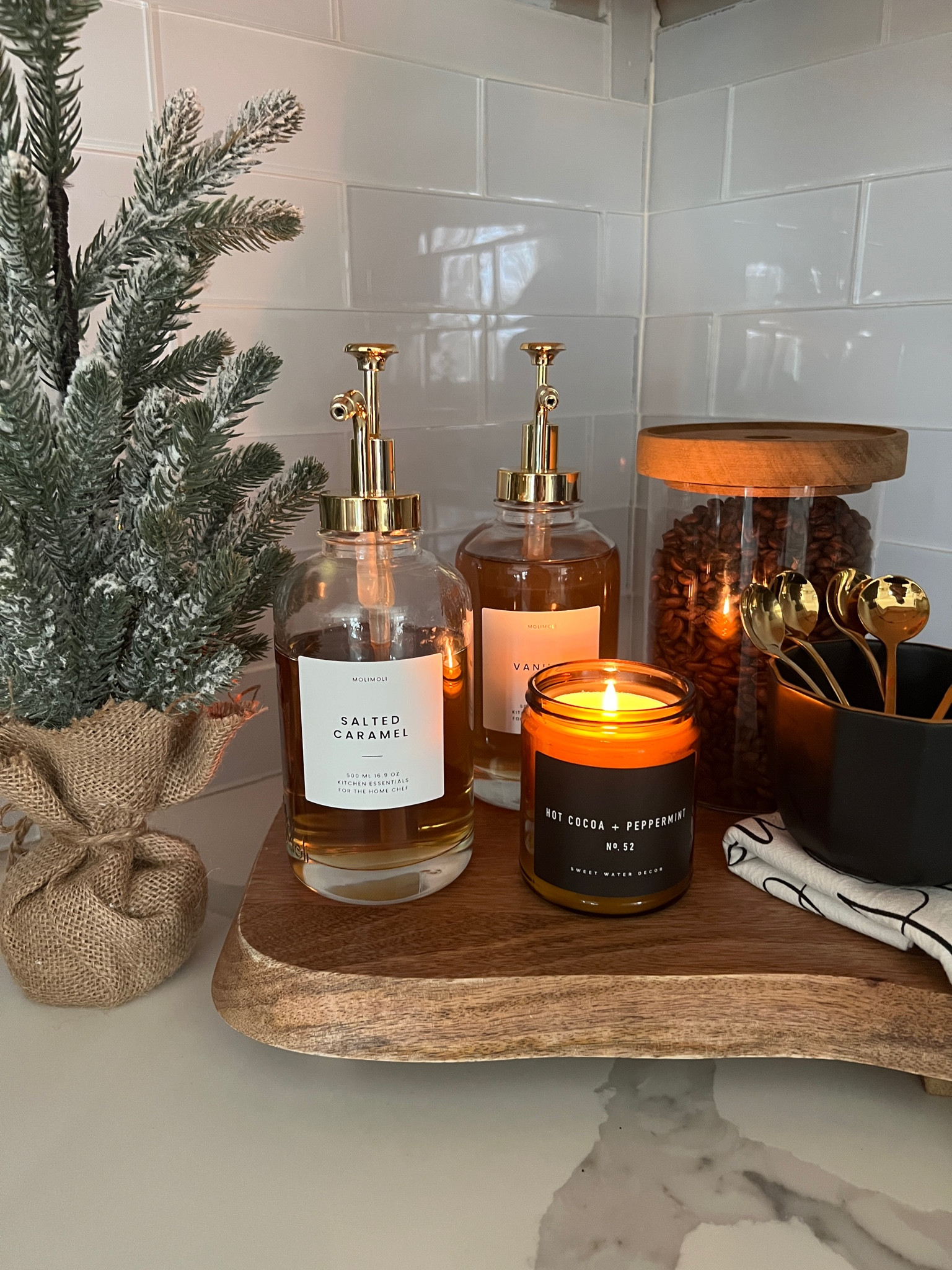 Christmas coffee bar setup - these coffee syrup bottles are 10% off and you can save an extra 5% with code LAURENHANSEN