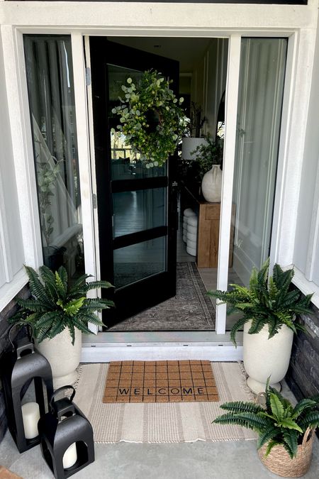 Spring refresh for the front door! Picked up a few things on sale at  Target! I love the modern look of the urns, so pretty paired with a classic fern. And the black lanterns are so good! They’re heavy duty and gorgeous. 
Spring outdoor, front porch inspo 
Circle week at Target 

#LTKsalealert #LTKSeasonal