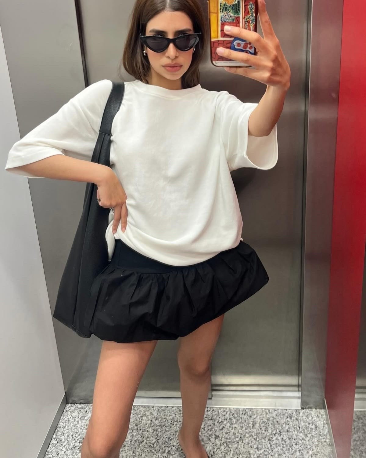 White shirt 
Black bubble skirt

#LTKfoodie #LTKmomlife #LTKMothersDay