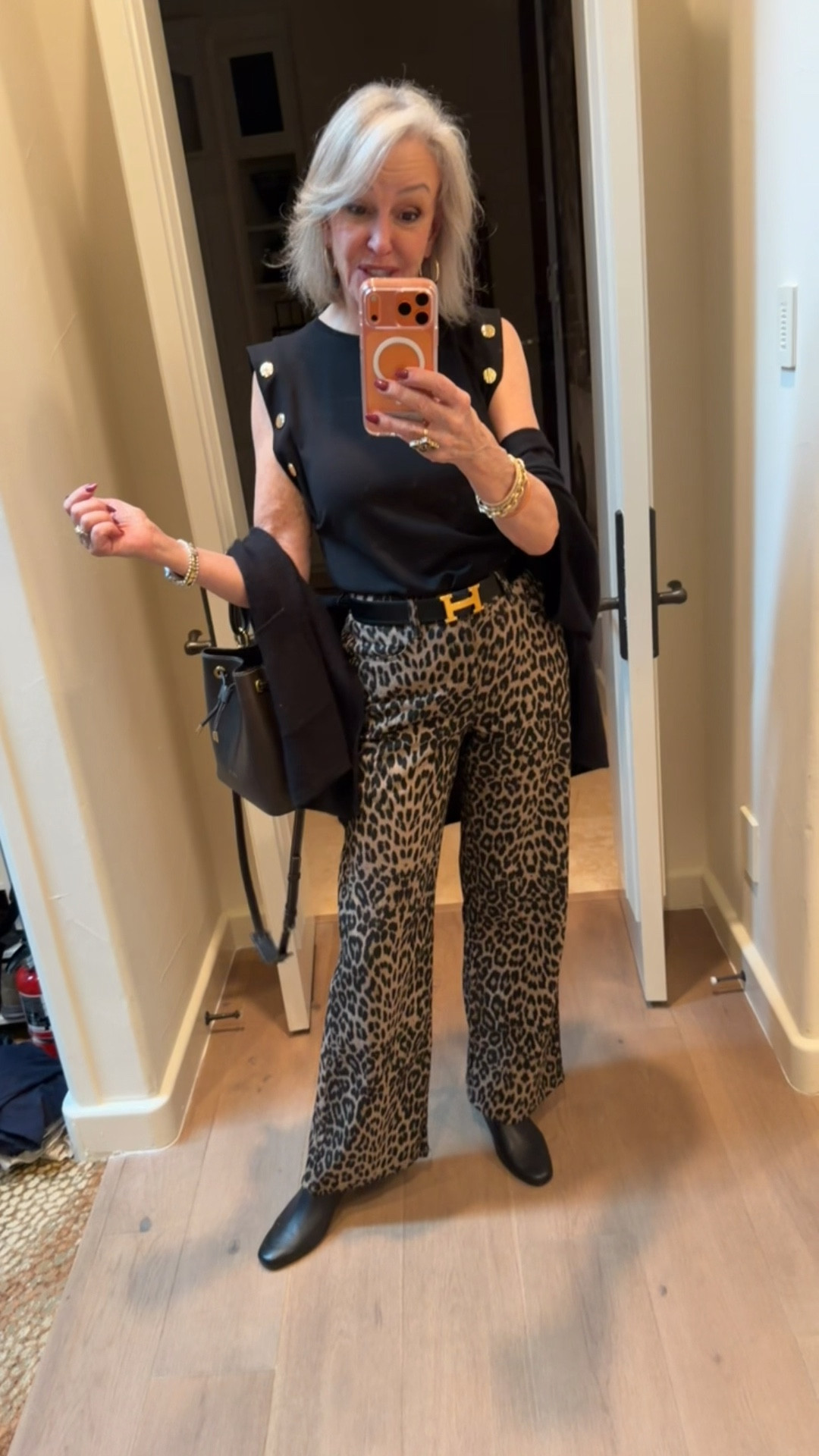 Saint & Sofia, Adjustable wide leg jean
Black sleeveless Roan tee with gold button accents 
Paris/64 leather bucket bag


#LTKOver40 #LTKWorkwear #LTKgrwm