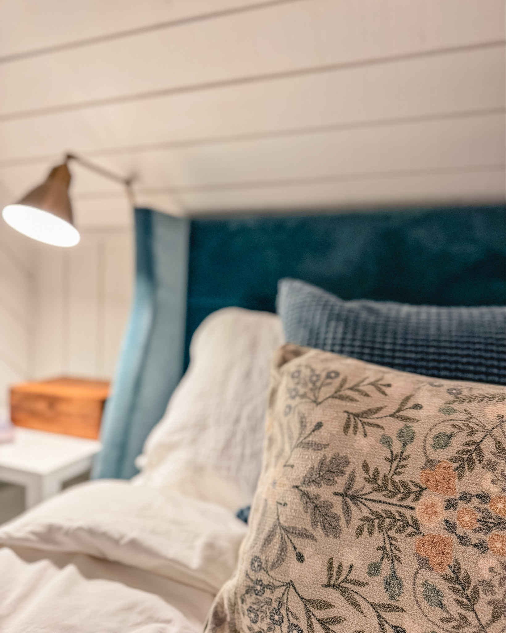 Interior Designer tip: Repetition. Notice how colors are repeated here. The decorative pillow in the forefront picks up the blue of the bed and the warm tones of the sconce and antique writing lap desk. In the next photos, you’ll see how it picks up the colors of the wave painting and the retro bathing suit set. As an interior designer, many of my pieces come from “to the trade” sources however I’ve linked a few similar options  

#LTKhome #LTKstyletip