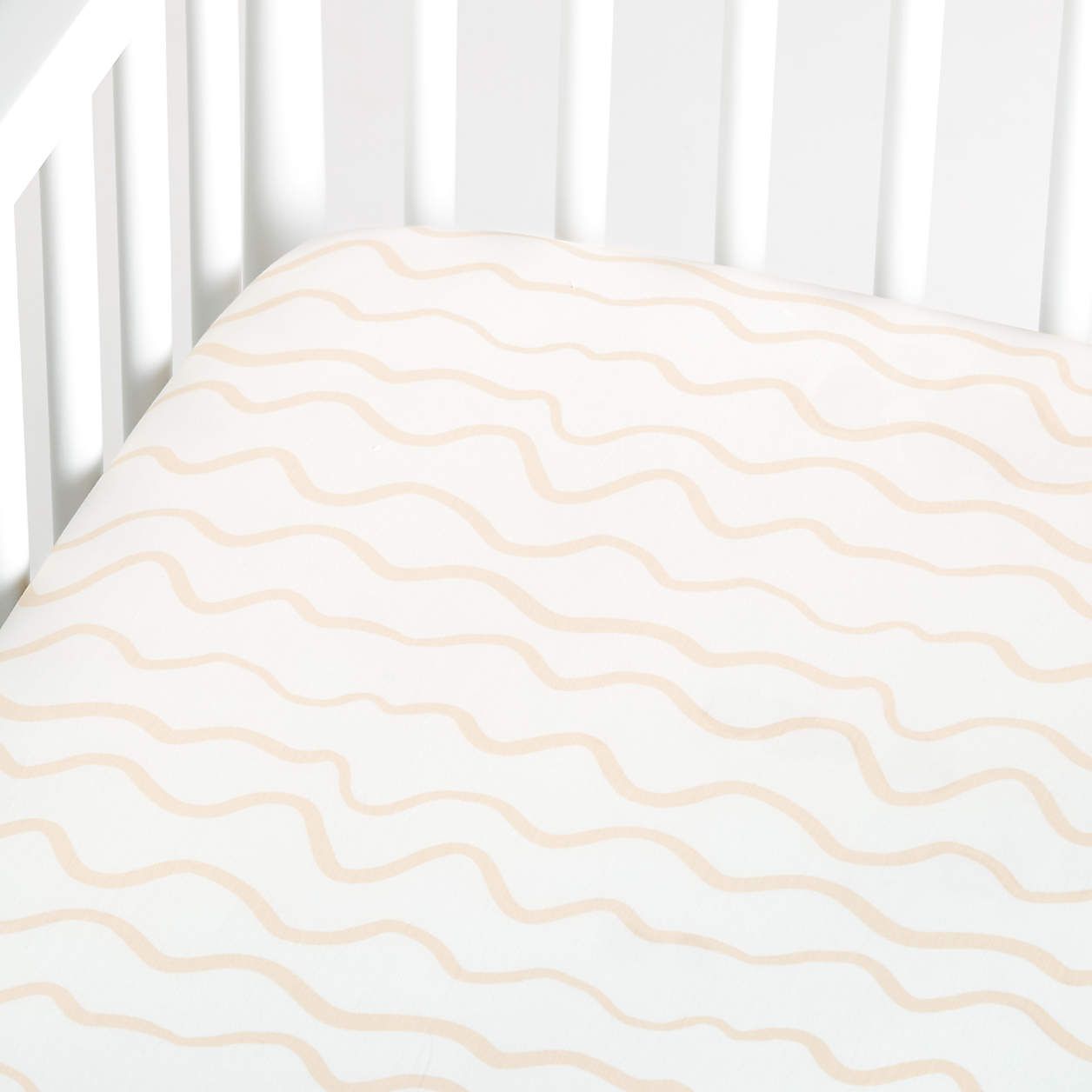 Modern Imperfect Stripe Organic Light Peach Baby Crib Fitted Sheet + Reviews | Crate & Kids | Crate & Barrel