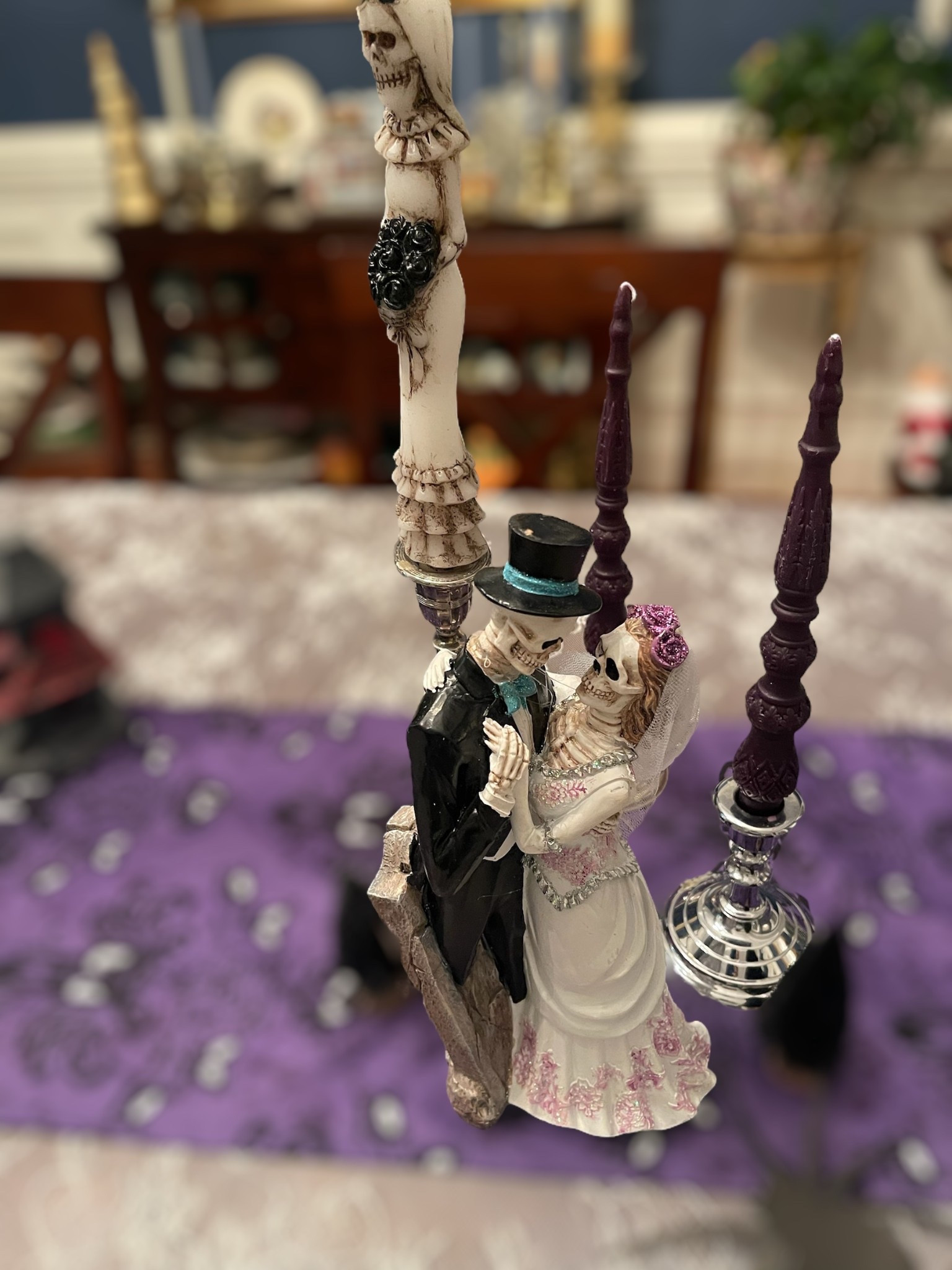 ✨🕯️ Transform your dining table into a hauntingly romantic Halloween tablescape with this gothic yet elegant setup! I layered a purple Halloween table runner with a vintage lace tablecloth to create a dramatic backdrop, then styled skeleton bride & groom figurines as the centerpiece 💀💜. Black and purple taper candles in silver candle holders bring the perfect moody glow, while skeleton details tie everything together for a chic Day of the Dead–inspired wedding theme. 🎃🖤

This look is perfect for a Halloween dinner party, gothic wedding décor, or spooky fall entertaining—mixing glam, romance, and just the right touch of creepy fun!

🛒 Shop the look:
	•	Skeleton bride & groom figurine centerpiece
	•	Skeleton taper candles
	•	Black & purple unscented taper candles
	•	Silver candle holders
	•	Halloween table runner
	•	Lace tablecloth

💀🎃 
Halloween tablescape décor • spooky table setting • skeleton wedding centerpiece • gothic Halloween party ideas • Day of the Dead table décor • purple & black Halloween theme • skeleton bride & groom decorations • elegant Halloween dining table • gothic glam Halloween inspiration


#LTKFindsUnder100 #LTKHome #LTKFindsUnder50