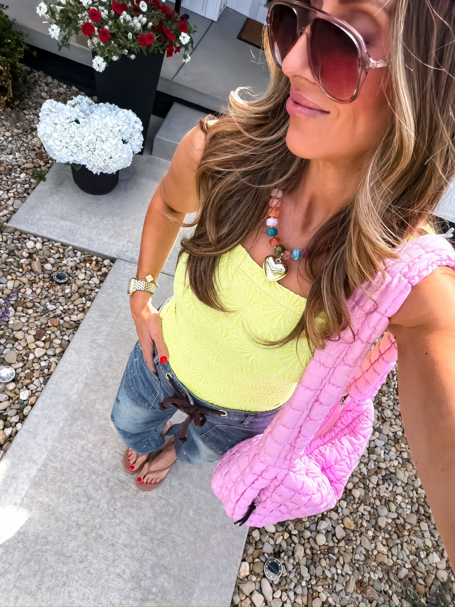 This colorful everyday outfit is such a fun mix of playful and casual 💗 The bright tank, relaxed jeans, and quilted tote make this look feel trendy without trying too hard. Perfect for coffee runs, errands, casual weekends, or summer travel days when you still want to feel cute and comfortable.

colorful casual outfit, everyday summer style, relaxed jeans outfit, casual mom outfit, trendy everyday look, pink tote bag outfit, comfy summer outfit, colorful accessories trend, casual chic style, effortless outfit idea, cute everyday fashion, themominstyle

#LTKOver40 #LTKSeasonal #LTKmomlife