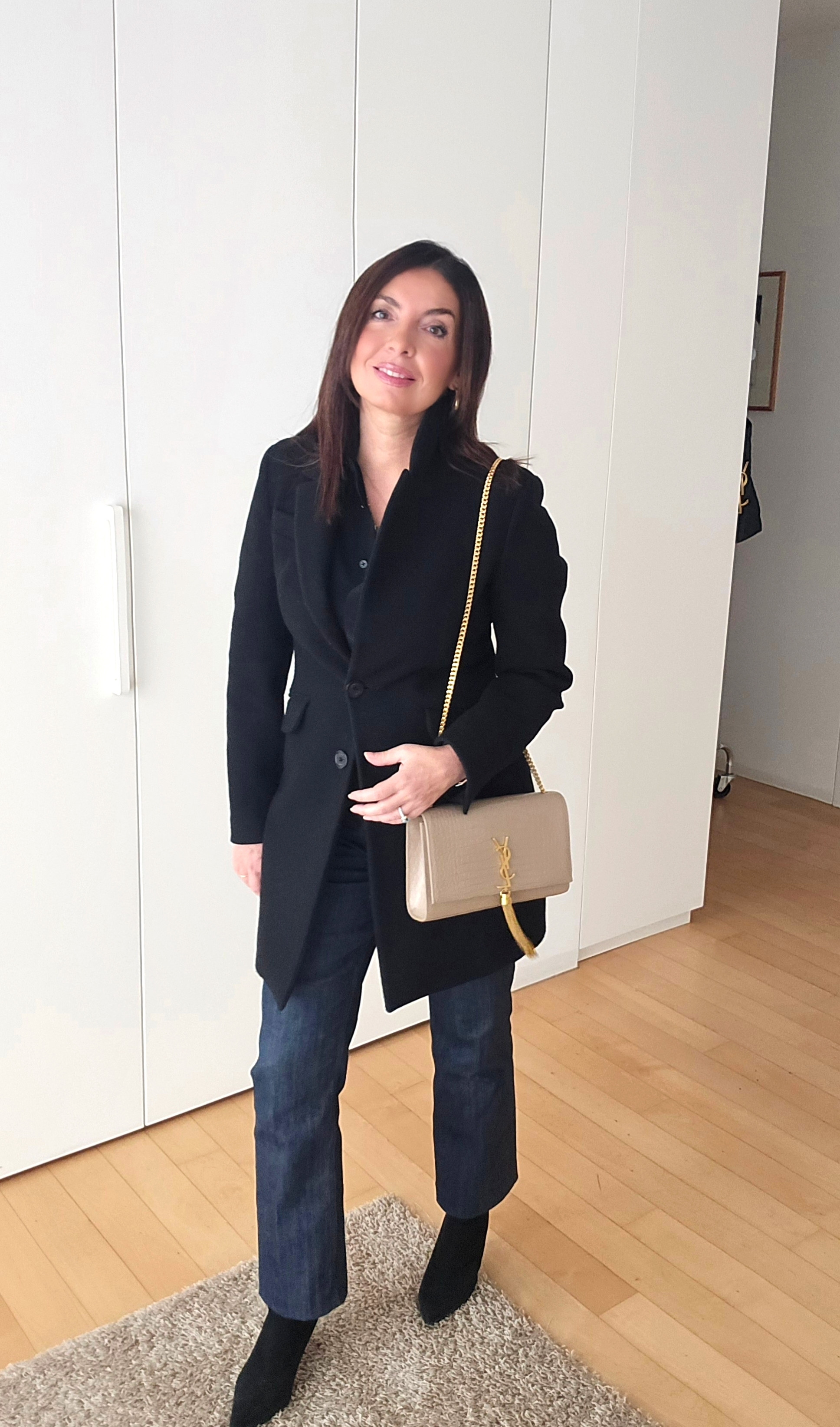 Pair a classic black coat with dark blue jeans for a chic yet casual vibe, and elevate the look with sleek black booties. Finish it off with the iconic YSL Kate bag for that touch of luxury. Perfect for city strolls or a polished everyday outfit. #WinterOutfitGoals #EffortlessChic #LuxuryStyle  

 #LTKitalia #LTKeurope #LTKover50style