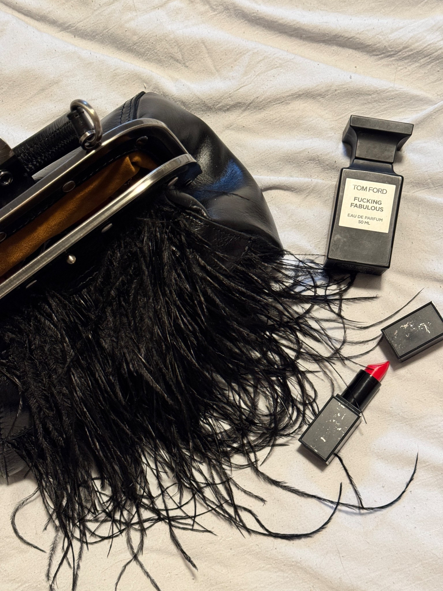 Details for wedding guest outfit. Bold, red lipstick and black clutch bag to match with a black flowy dress

#LTKBeauty