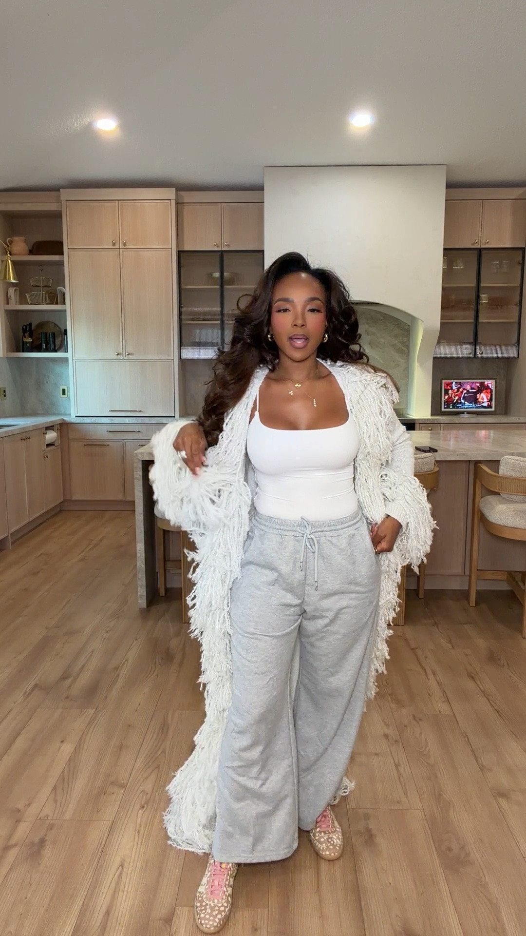 Cozy but make it chic! 🤍✨

This fluffy statement cardigan paired with wide-leg sweatpants and a fitted white tank is the ultimate elevated lounge look! Perfect for coffee runs, travel days, cozy weekends, and looking put together while staying comfortable.

Size Small | 5'4" | 140 lbs | 34D - 27 - 40

Shop everything linked below in my LTK!

cozy fall outfits, elevated loungewear, fluffy cardigan outfit, shaggy knit cardigan, wide leg sweatpants, grey sweatpants outfit, casual chic outfits, cozy cardigan outfits, fall fashion 2026, comfy airport outfits, travel outfit ideas, elevated casual style, white tank top outfit, cozy weekend outfits, stylish loungewear sets, neutral fall outfits, fall layering essentials, casual mom outfits, effortless everyday style, comfortable fall fashion, oversized cardigan outfit, trendy lounge outfits, chic athleisure outfits, petite casual fashion