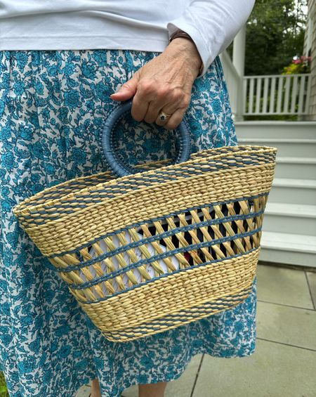 My mom has been using this chic raffia woven bag from Pamela Munson all summer. She loves it! 