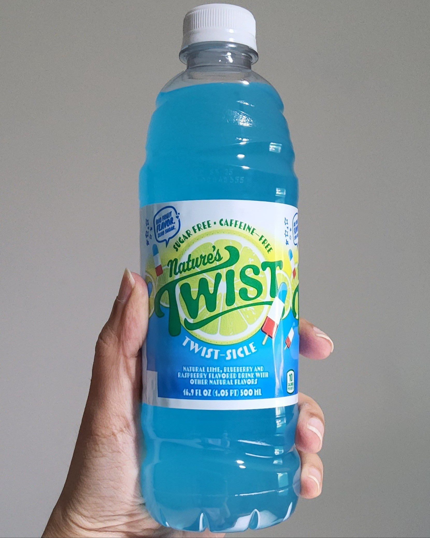 Nature's Twist Twist-sicle drink comes in a pack of 24 individual bottles. After tasting it, I am addicted to this drink! The taste is just like that of the popsicle and the texture is very smooth. It is easy to drink and it's very refreshing. I have a sweet tooth and this drink has a good amount of sweetness to it. There is some tartness in the aftertaste. It has natural blueberry and raspberry flavors. I love that it has only natural flavors. 

#LTKParties #LTKFamily #LTKActive