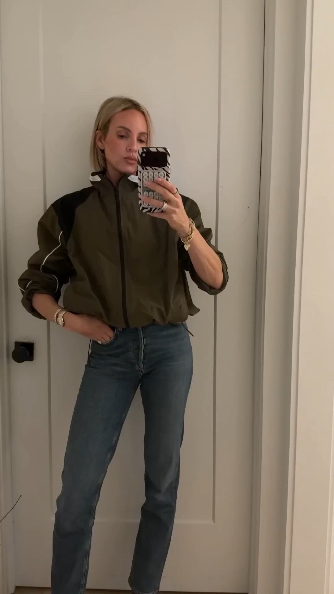 Wearing a medium in the windbreaker. Size down at least one size in the jeans. I sized down two￼