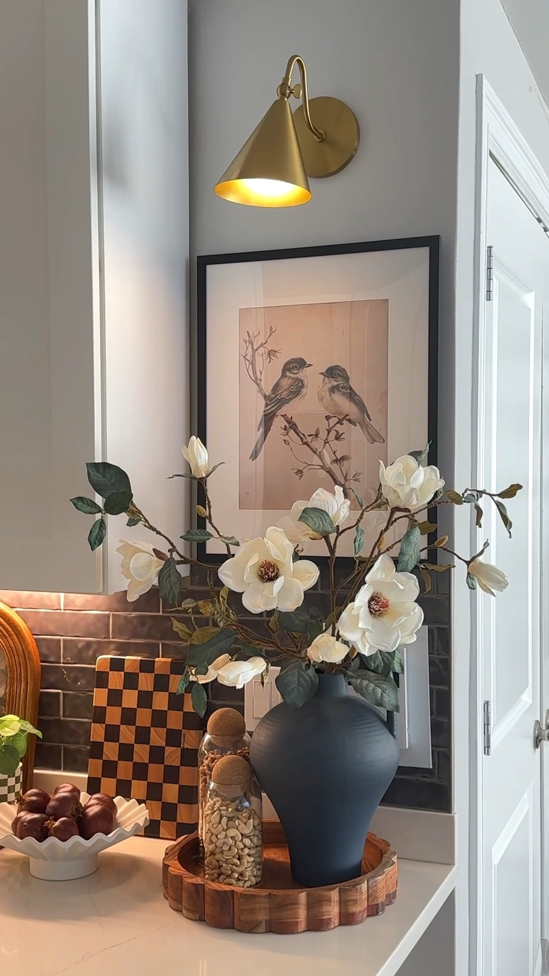 Spring kitchen corner styling with a hidden electrical panel 🤍
This corner used to be my least favorite… I’m so glad I made this change. I added neodymium magnets behind a lightweight frame to cover the electrical panel, and now I love styling it for every season! 

#LTKSeasonal #LTKHome