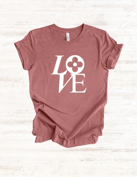 Perfect LOVE graphic tee! Casual style that’s 100% cotton. Fits a half size large for women. 

#LTKfindsunder50 #LTKGiftGuide #LTKstyletip