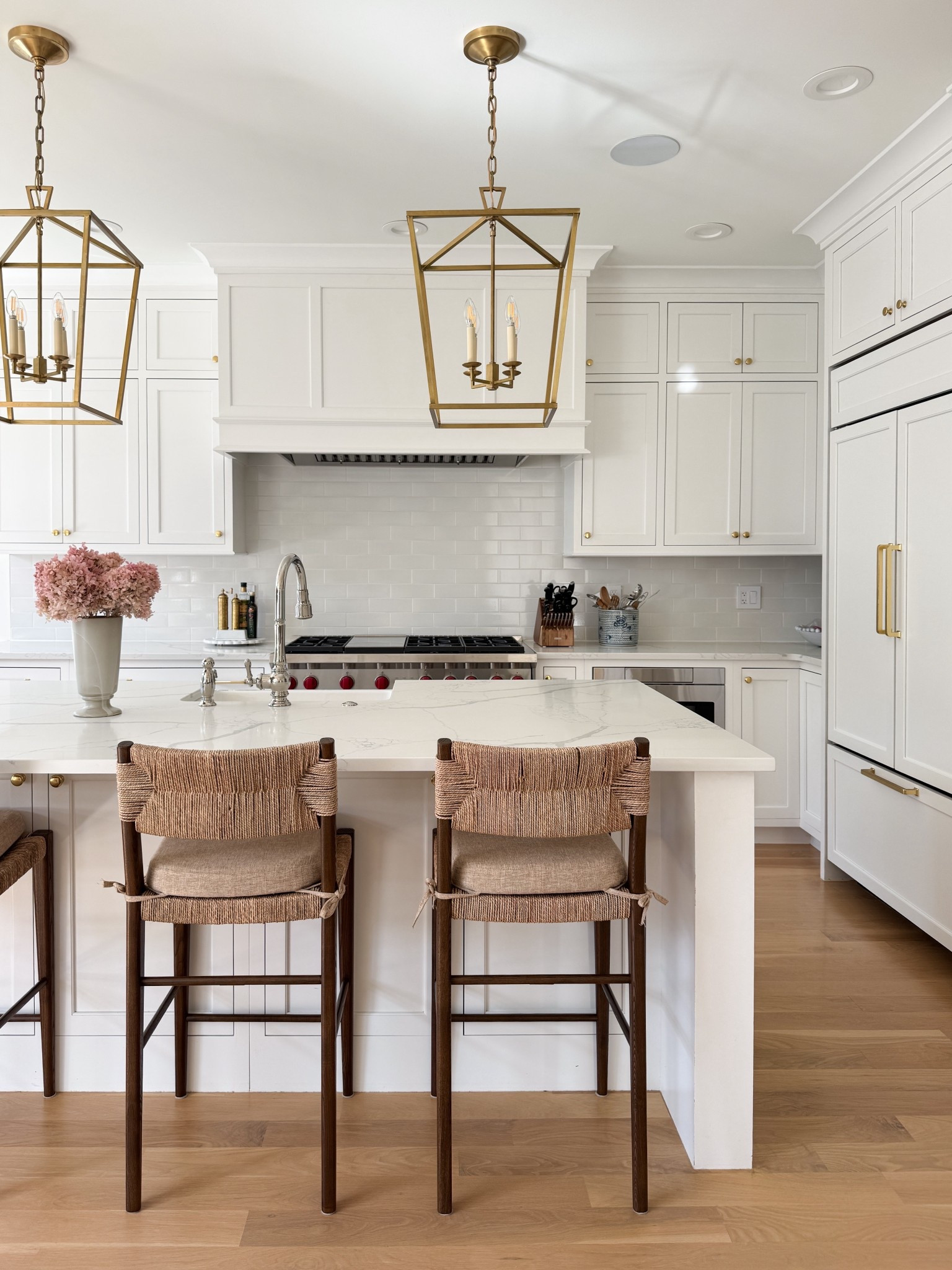 White kitchen, brass lanterns, brass kitchen cabinet hardware, fall florals, walnut wood and woven coastal counterstools 

#LTKHome #LTKSaleAlert #LTKSeasonal