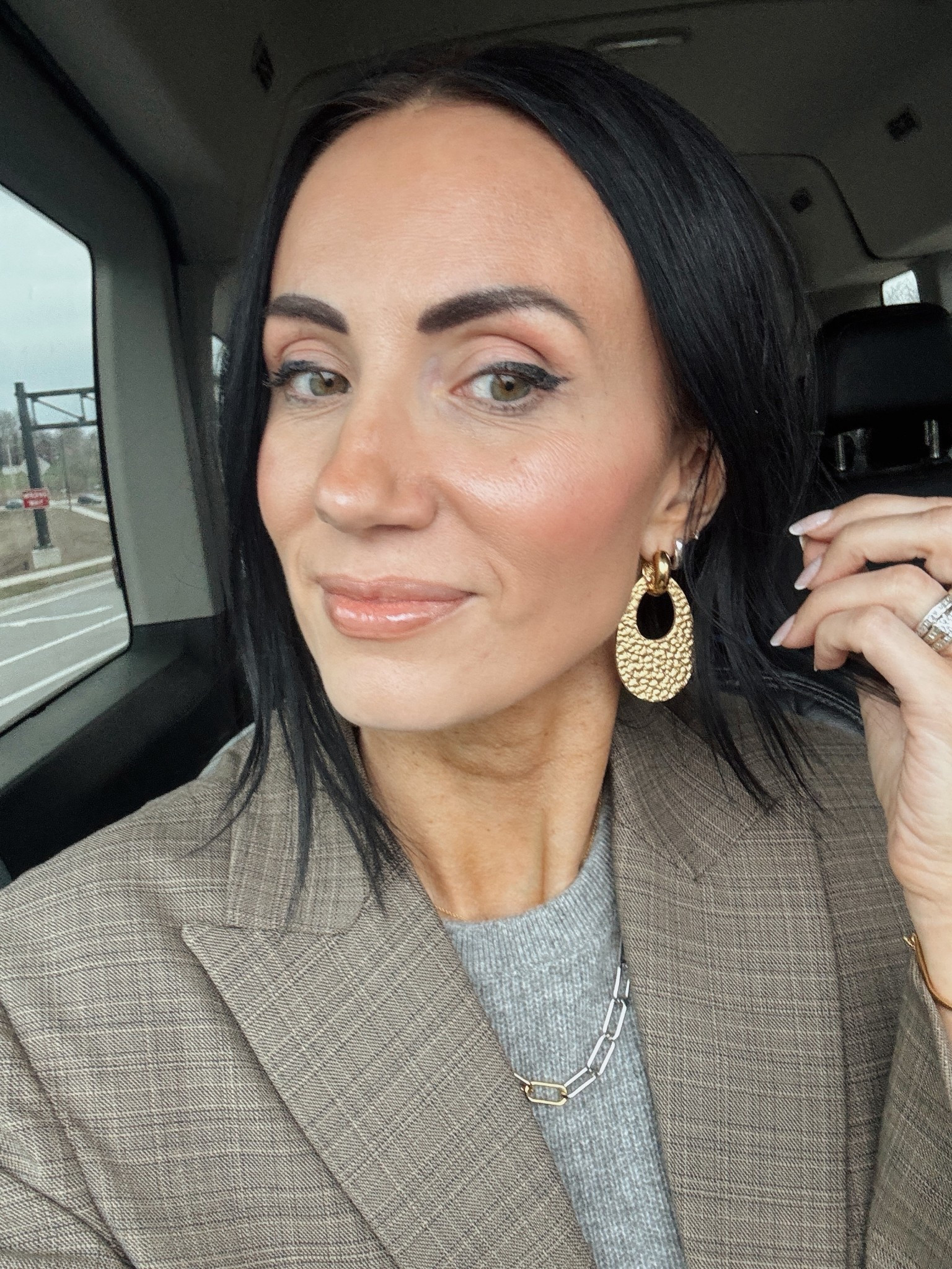 These hammered gold earrings are actually leather- super light and cool because they can come off the hoop and be worn as just a small hoop.
