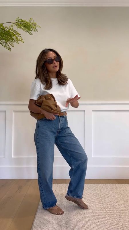 Spring transitional outfit. Wearing an oversized tshirt and jeans with mesh ballet flats. 

#LTKfindsunder100 #LTKstyletip #LTKSeasonal