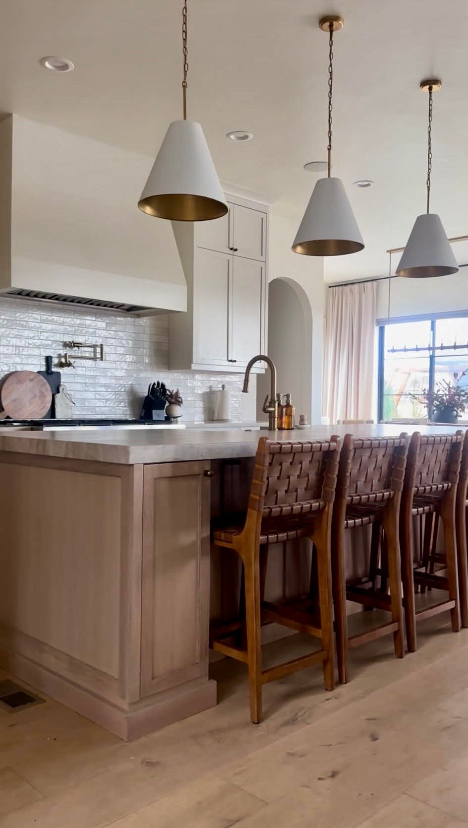 I wanted this kitchen to feel warm, layered, and timeless, with a mix of soft wood tones, woven textures, and simple brass details. The woven counter stools are still one of my favorite pieces in this space and add so much character without overwhelming the room.

I’ve linked the lighting, counter stools, kitchen faucet, and a few of the decor pieces I use throughout this space. These are the everyday details that make the kitchen feel elevated, functional, and easy to live in.
@Wayfair 
@Nathan James 
@lowes 
@Walmart

#LTKHome