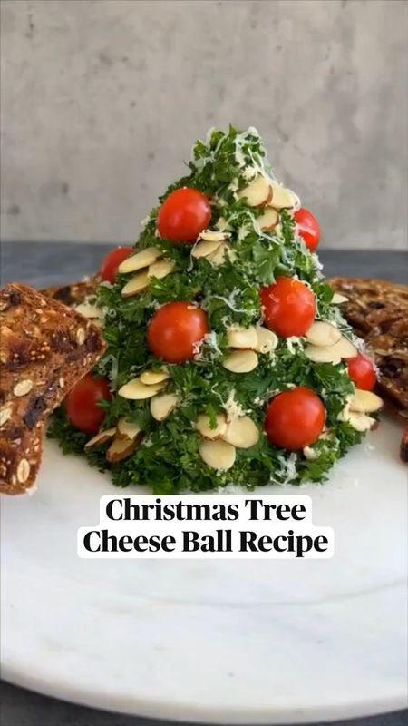 CHRISTMAS TREE CHEESE BALL using @RothCheese Grand Cru. Cheese balls are my go-to for a delicious & easy holiday appetizer because they can easily be made in advance and then set out for guests when ready. #RothPartner
 
With just 6 ingredients you can make this showstopper. To ensure that my cheese ball is especially flavorful, I use @RothCheese Grand Cru, an alpine-style cheese that’s robust and full-bodied. Use it to jazz up your holiday appetizers. And if you need help, #RothCheese even lists out pairing suggestions on the package!! Find Roth Grand Cru in the deli case at your local grocer. #rothcheese
 
INGREDIENTS

16 oz cream cheese, softened
1 6 oz block Grand Cru cheese, shredded
1 oz dry onion soup mix (1 envelope)
1/3 cup sliced almonds 
6 cherry tomatoes, halved
½ cup parsley, chopped
Crackers of choice

INSTRUCTIONS

1. Mix cream cheese and dry soup mix in medium bowl until well blended.

2. Add shredded Grand Cru cheese; mix well.

3. Shape into a cone.

4. Press the parsley onto the outside of the cone using plastic wrap.

5. Refrigerate for 2 hours. Let tree stand at room temperature 15 minutes before serving.  Press in tomato halves and sliced almonds to decorate.

6. Serve with crackers and enjoy!


#LTKGiftGuide #LTKHoliday #LTKSeasonal