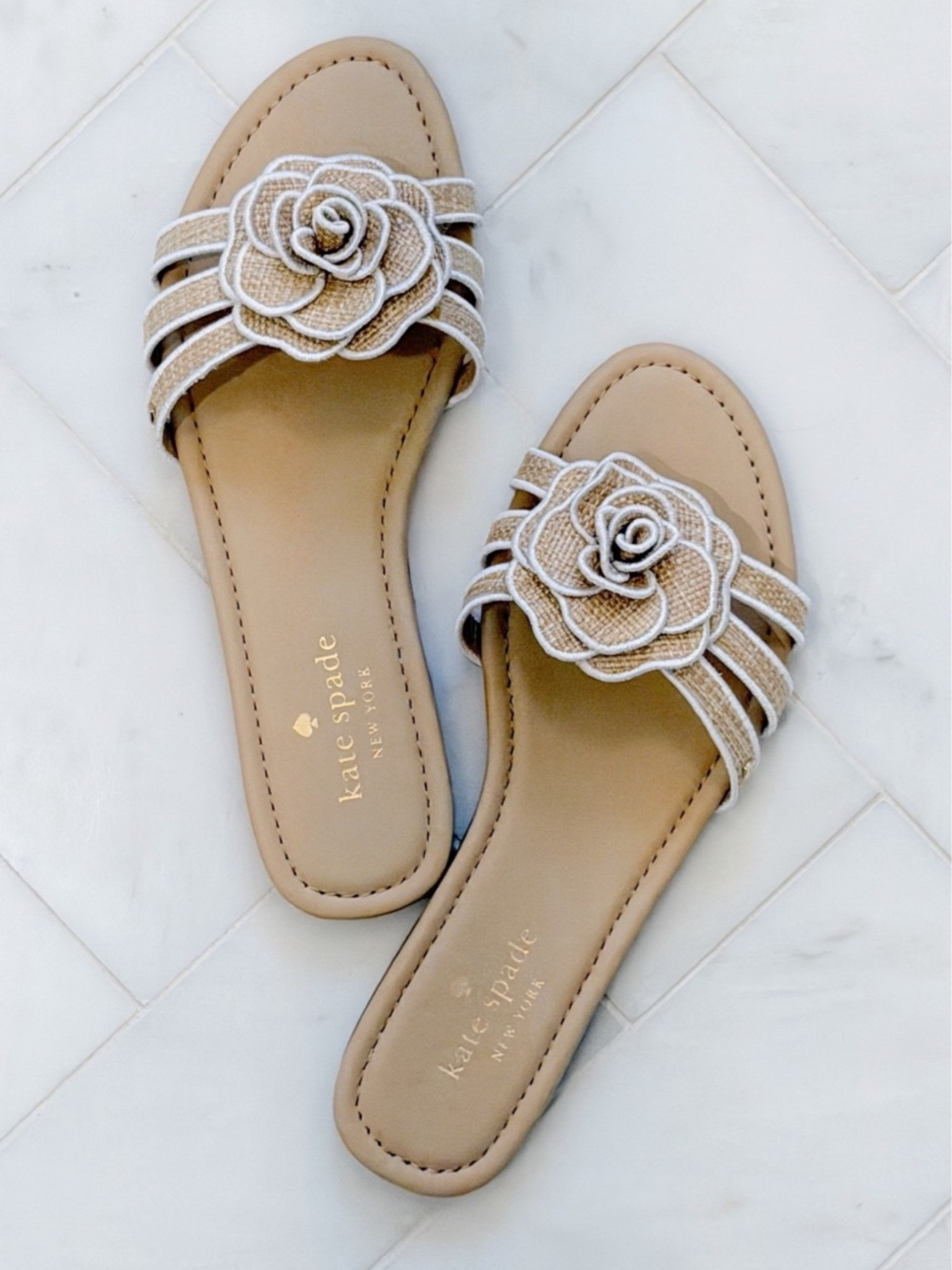 Now on sale! Obsessed with these white and beige neutral floral sandals for summer. The flower detail with the white stitching is so coastal & pretty. Runs a little small so size up!

#LTKSeasonal #LTKootd #LTKSaleAlert