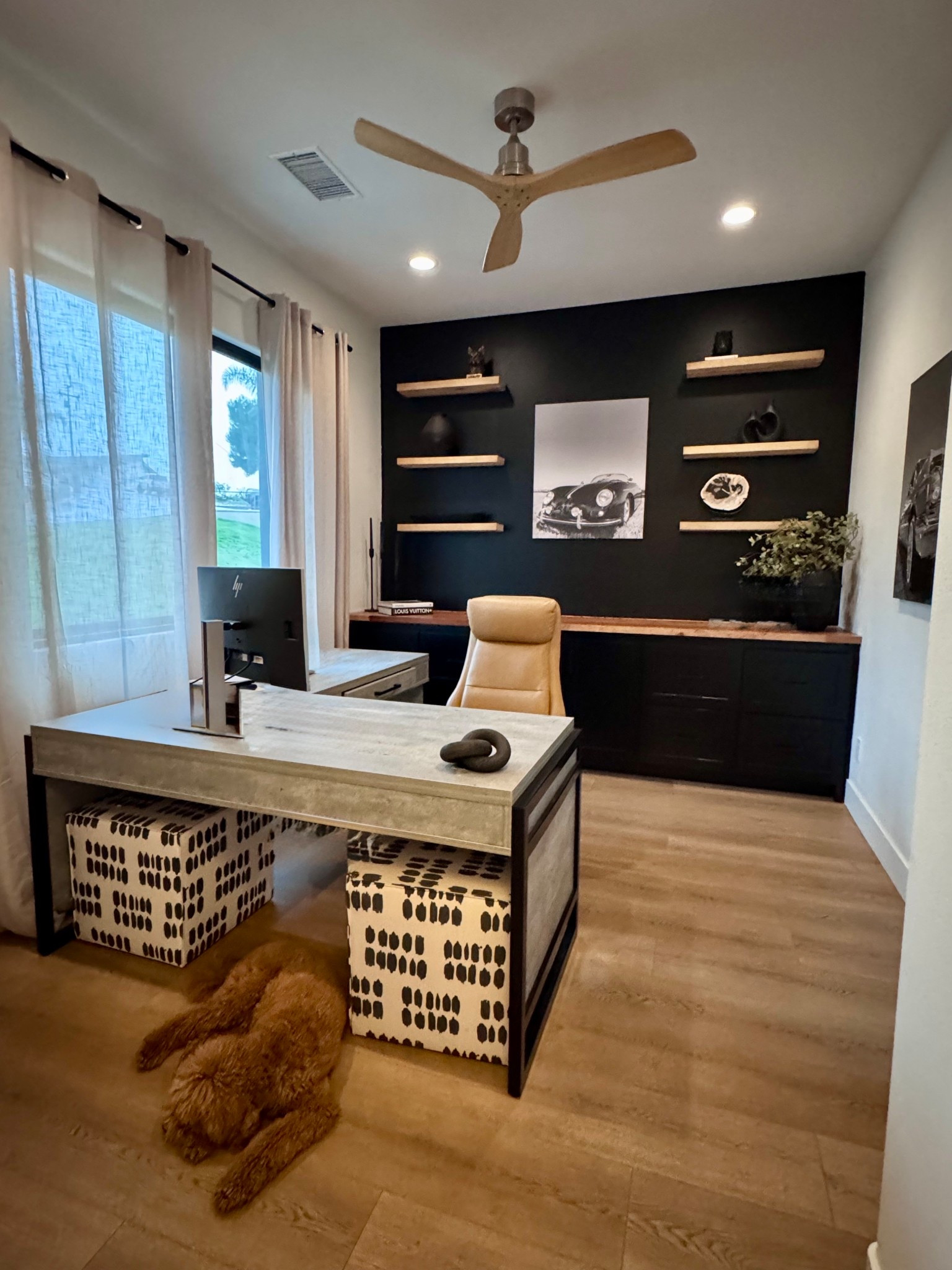 Office design | work space decor | interior design | office chair | desk | wood shelves | ottoman | black wall 

#LTKBeauty #LTKU #LTKHome