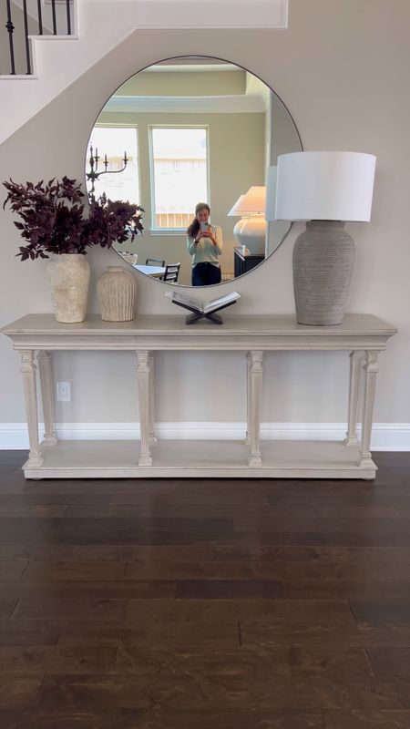 A little entryway refresh. I added the Pottery Barn Lamp here with the Artisan Pottery Barn Vases and book stand. Of course the OKA table is always a favorite and so is the 42” CB2 round mirror. Beigewhitegray 

#LTKstyletip #LTKhome