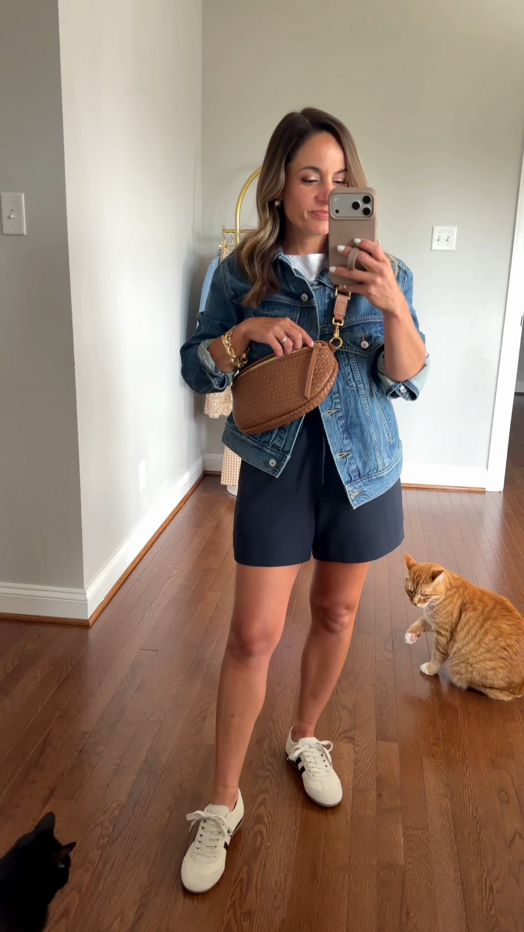 If my favorite sling bag and crossbody bag from Quince had a baby - this bag would be it! 

I love the size, appreciate the thinner strap (if you compare it to the sling bag) and love the woven texture. 

Shorts (Aritzia): xs 
Jacket (Abercrombie): xxs 
Tank top (Quince): xs - back in stock! 
Sneakers (Quince): true to size