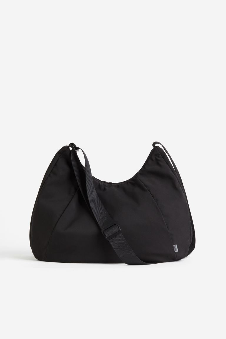 Water-repellent sports bag - Black - Ladies | H&M GB | H&M (UK, MY, IN, SG, PH, TW, HK)