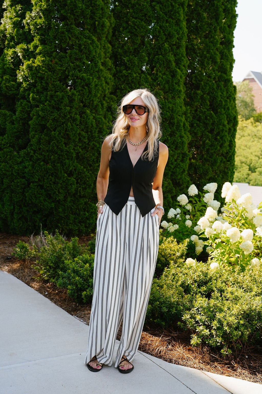 OOTD ✨ Black sleeveless vest + striped wide-leg pants + black sandals. A classic black & white look that feels polished but still effortless. Added my favorite sunnies + layered gold jewelry to finish it off. Everything shoppable below! 👇
#LTKdayinmylife #LTKootd #LTKOver40