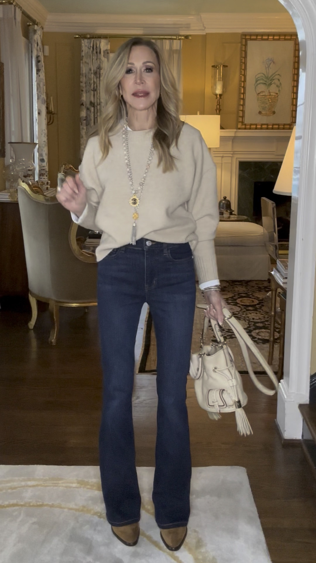 Closet essentials look made up of flare jeans, a cream Crewneck sweater, tan suede cowboy booties, a cream handbag and fabulous jewelry!


#LTKSeasonal #LTKShoeCrush #LTKStyleTip