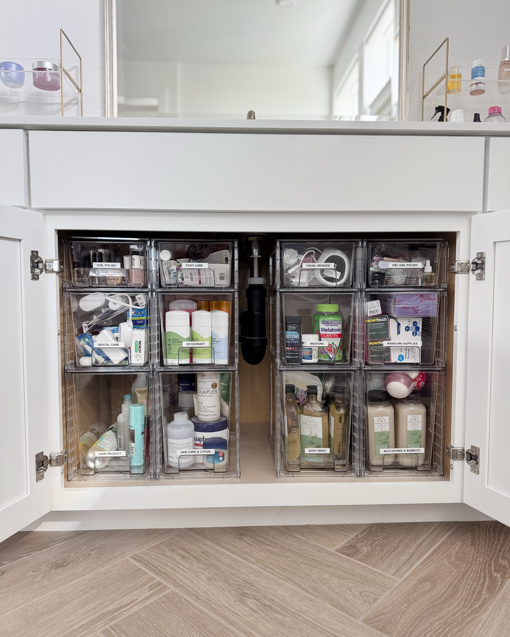 It felt so good to finally organize the undersink cabinet! I found some stackable storage drawers that I really like and labeled them with my favorite label maker. Now every little thing has a home and it makes finding things so much easier. 