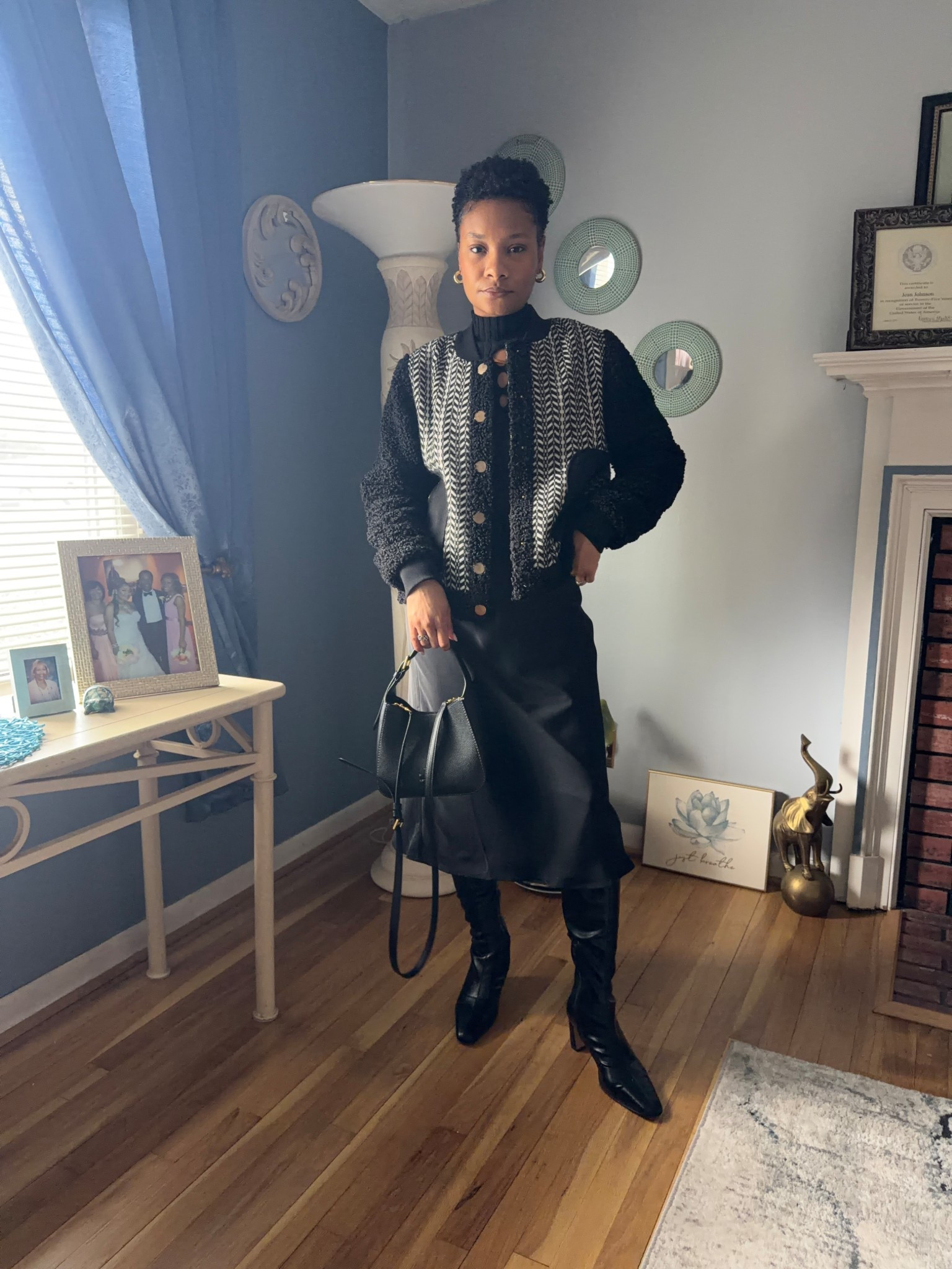 An easy all black look with pieces that you probably already own! 
Statement jacket + turtle neck + satin skirt + knee high boots 