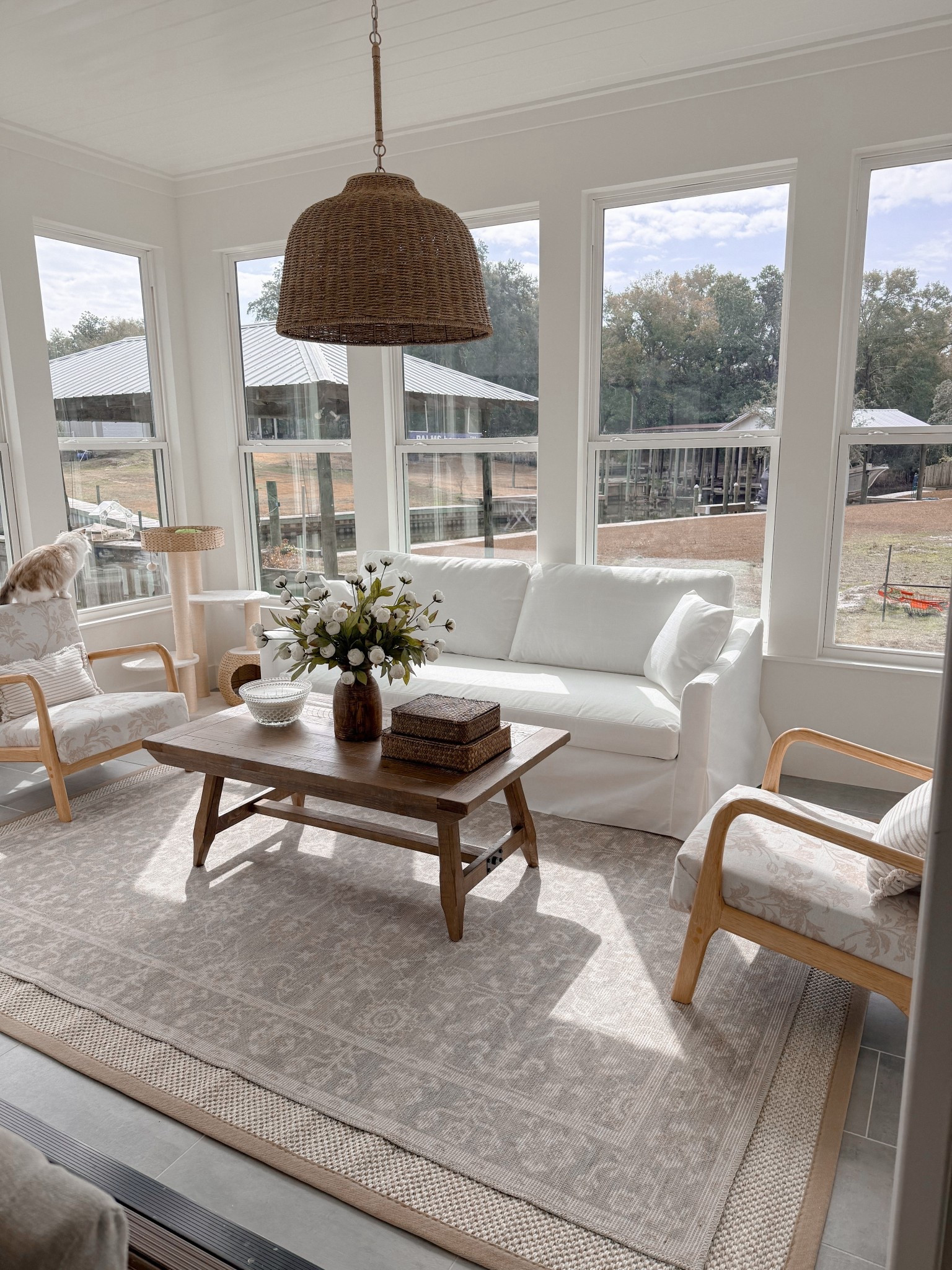 Sunroom furniture. Slipcovered couch. Coffee table. Rug. Accent chairs  

#LTKHome