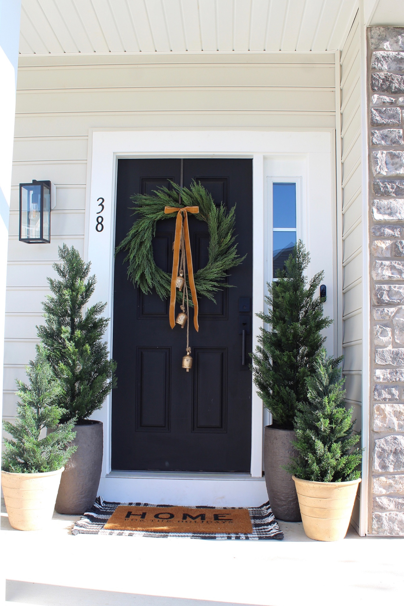 Trees, cedar trees, wreath, bells, ribbon, pots 

#LTKHoliday #LTKhome #LTKSeasonal