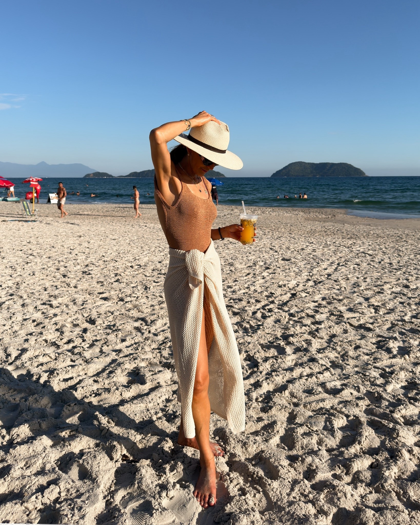 Time to unplug! Chic neutral resort outfit, brown one piece suit, crochet two piece set, and straw hat

#LTKTravel #LTKootd #LTKHoliday