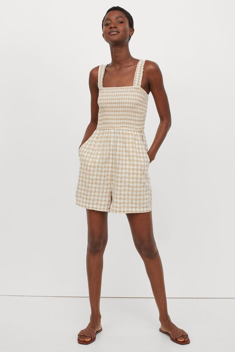 Romper in a woven viscose and cotton blend. Wide, smocked shoulder straps, a smocked bodice, and ... | H&M (US + CA)