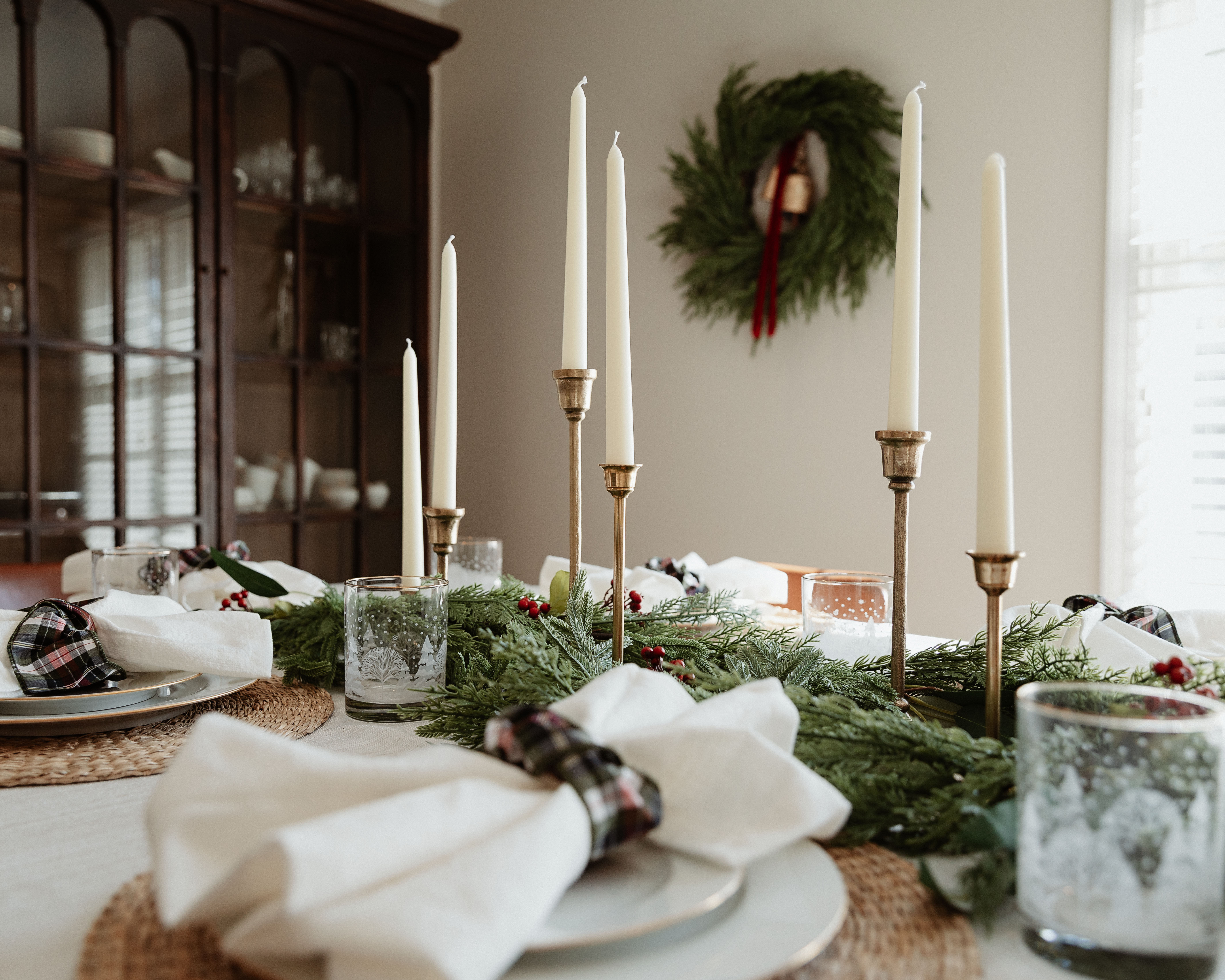 Christmas tablescape ideas! Perfect table setting for a dinner party or holiday dinner. Complete the look with candlesticks, tablecloth, napkin rings, chargers, and greenery. #christmastable #holidayhosting #christmasdinner #dinnerparty #tablesetting #christmastablescape #holidayparty 

 #LTKHoliday #LTKSeasonal #LTKHome