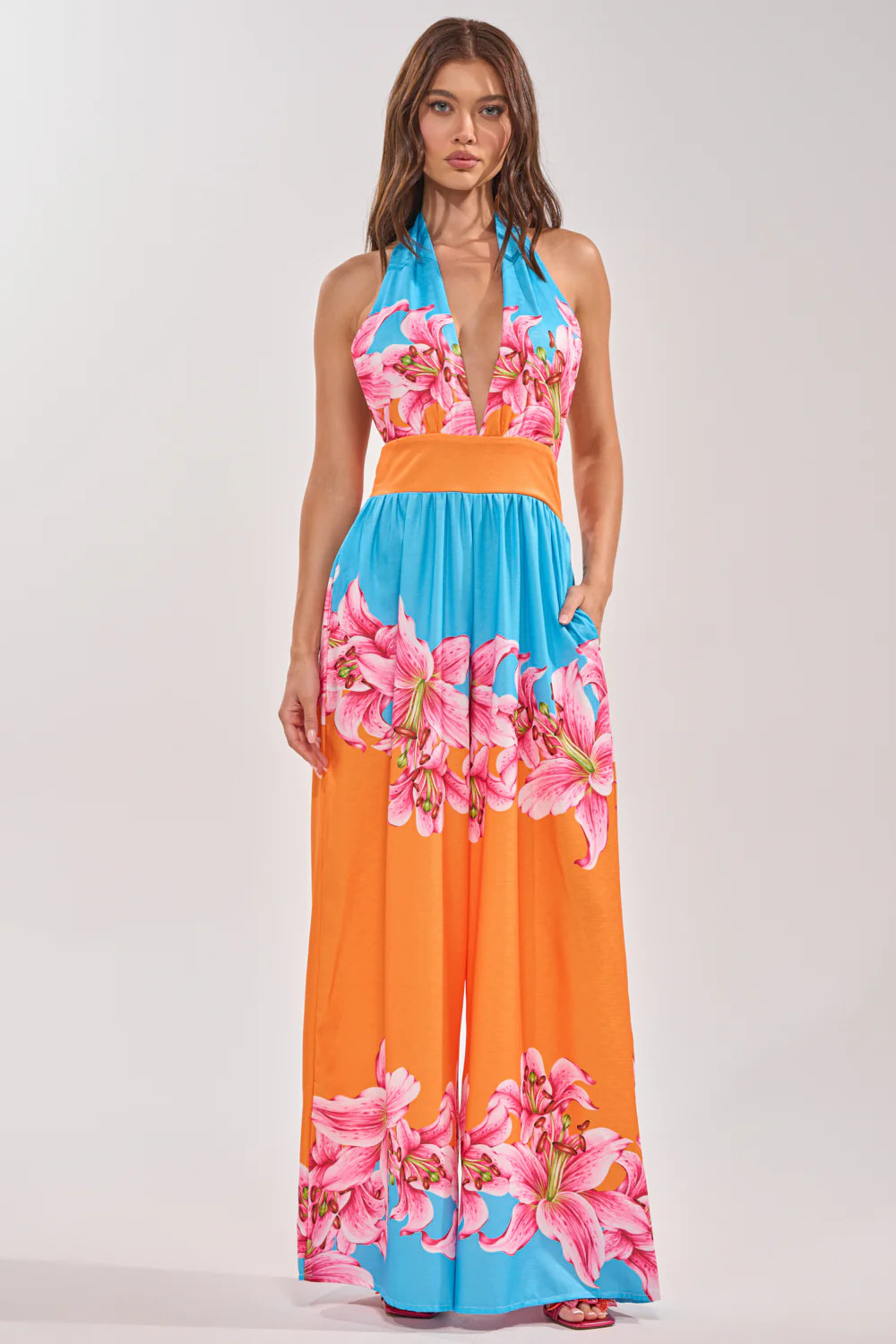 ON VACA TIME HALTER FLORAL PRINT JUMPSUIT | AKIRA