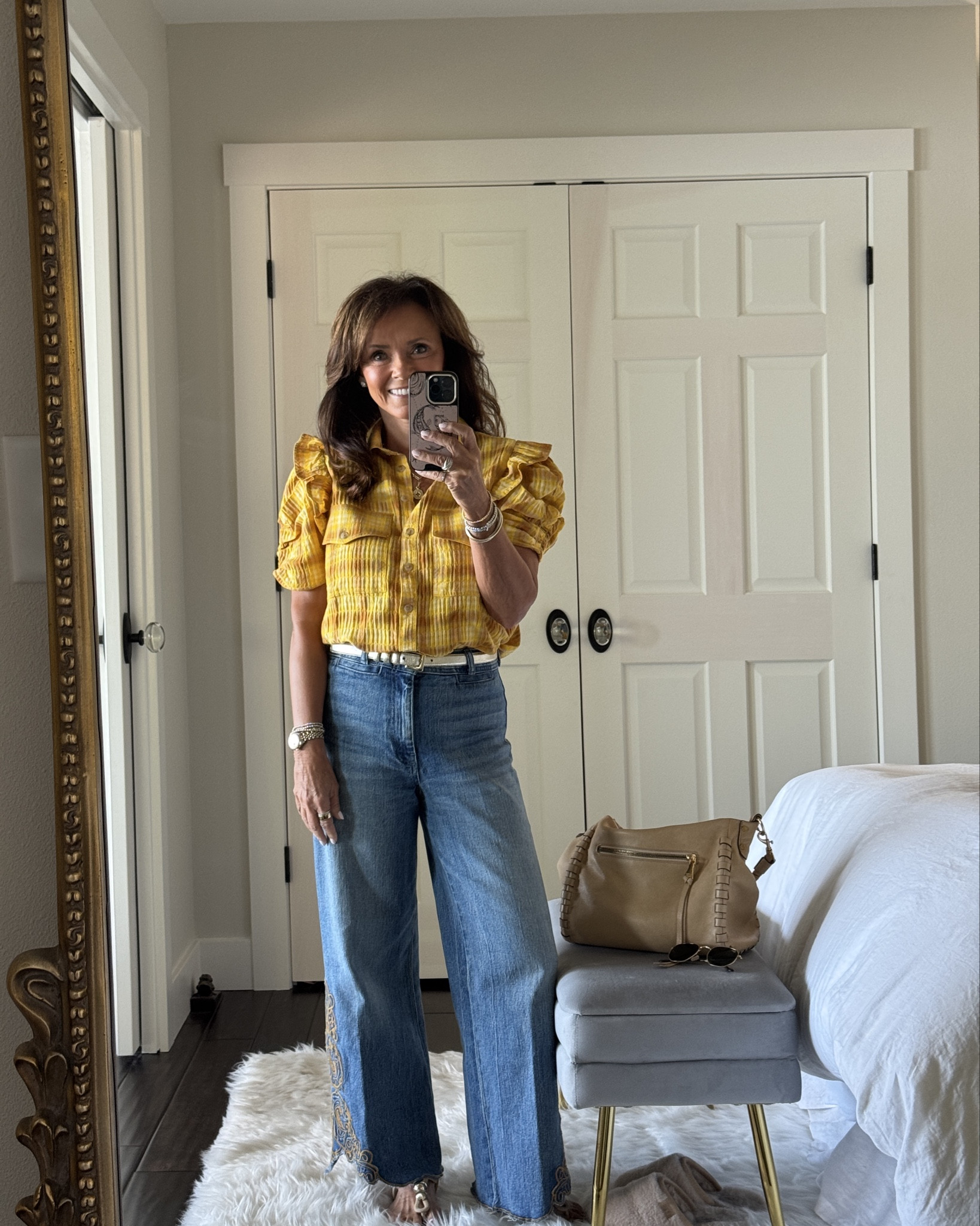 This transitional fall outfit begins with this new plaid button down top. It’s not your typical plaid shirt that’s for sure. Shirred sleeves and ruffles for the win. 
kimbentley, fall outfit, fall handbag, 


#LTKItBag 

#LTKootd #LTKSaleAlert